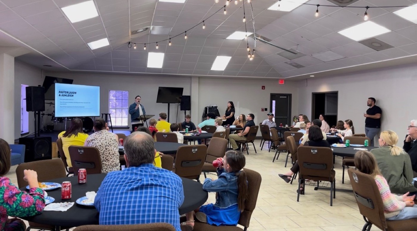 Families at a lunch in the fellowship hall